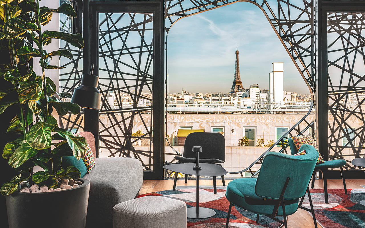 view on the eiffel tower from the rooftop of the 4 star hotel novotel paris vaugirard designed by the studio jean-philippe nuel